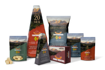 Assortimento di formaggi Trentingrana: grattugiato, cubetti e burro trentino. Prodotti caseari del Trentino. - Trentingrana