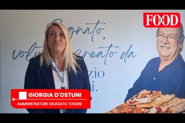 Giorgia D'Ostuni, amministratore delegato Tossini, davanti a un poster aziendale nell'Ovadese.