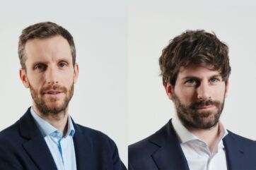 Ritratto dei manager di Cereal Docks in giacca e camicia su sfondo neutro per l'intervista sulle filiere agroalimentari.
