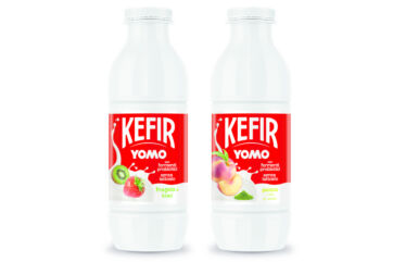Due bottiglie Yomo Kefir Granarolo, etichette rosse con frutta, linea innovativa benessere.