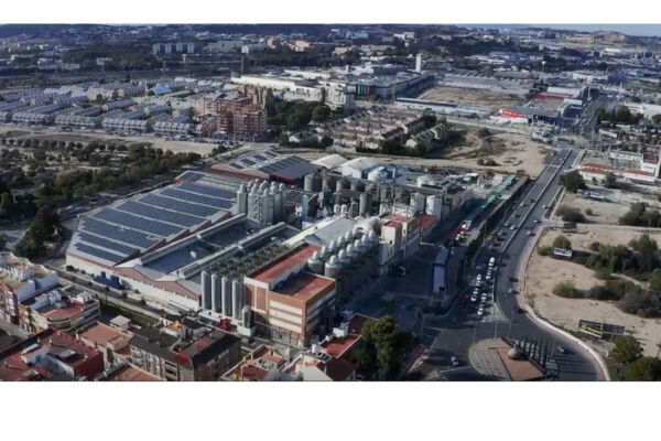 Estrella de Levante brewery aerial view. Damm Group's vision: innovation and growth. Solar panels, industrial complex.