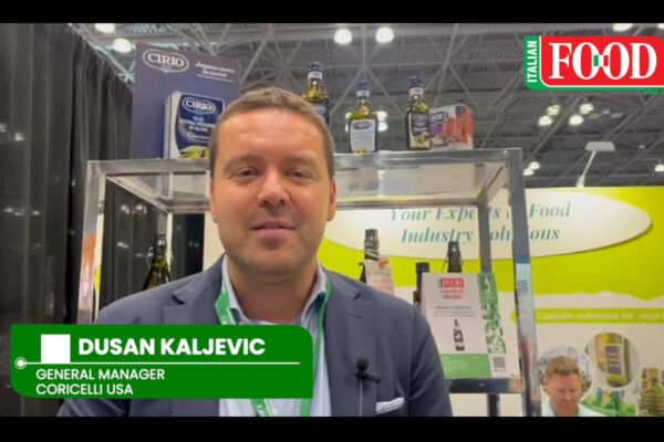 Coricelli USA at SFFS 2025. Dusan Kaljevic, General Manager, with Italian food products on display.