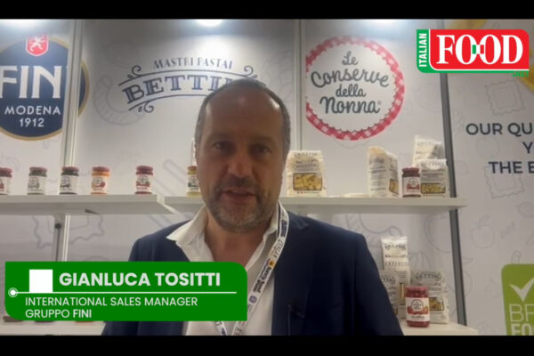 Fini Italian pasta at SFFS 2025. Gianluca Tositti, International Sales Manager, Gruppo Fini, stands near pasta and conserve products.