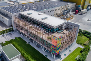 Andriani Group headquarters in Italy. Modern building with solar panels on roof. Food industry multinational company.