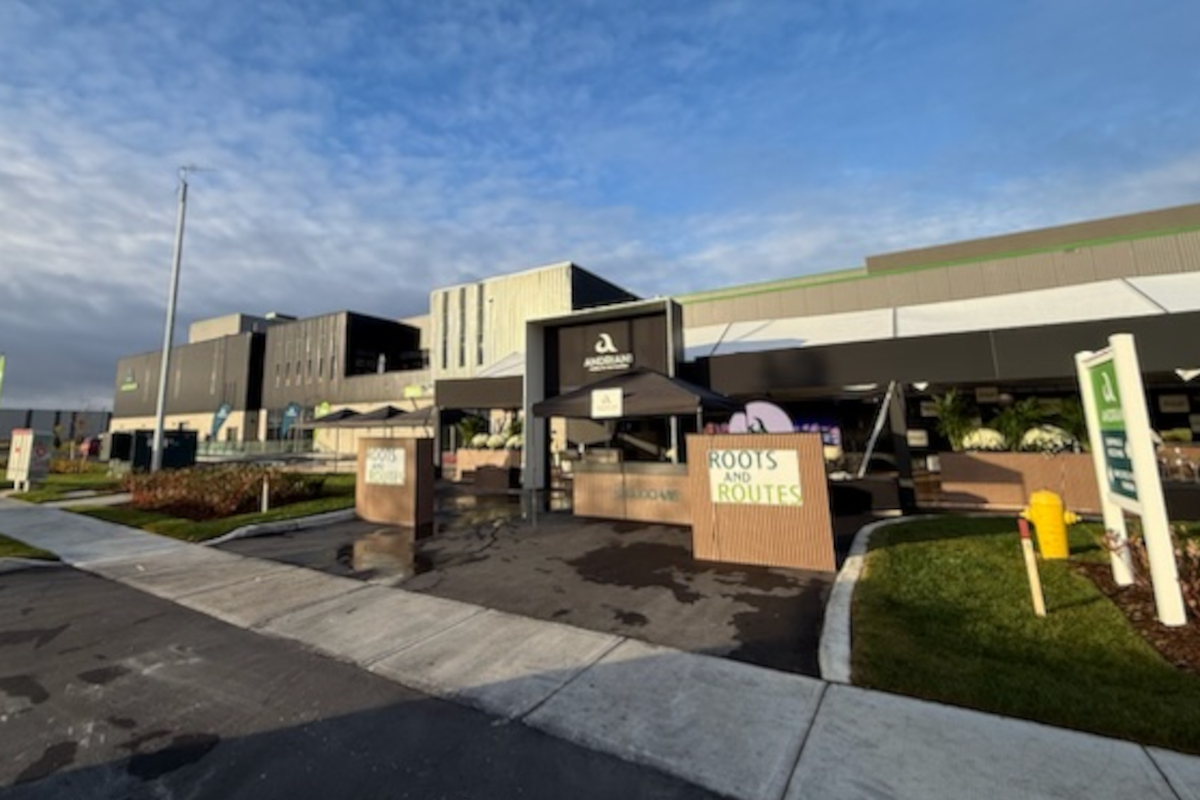 Andriani plant in London, Ontario. Modern industrial building with Roots and Routes signage. Architecture, exterior.