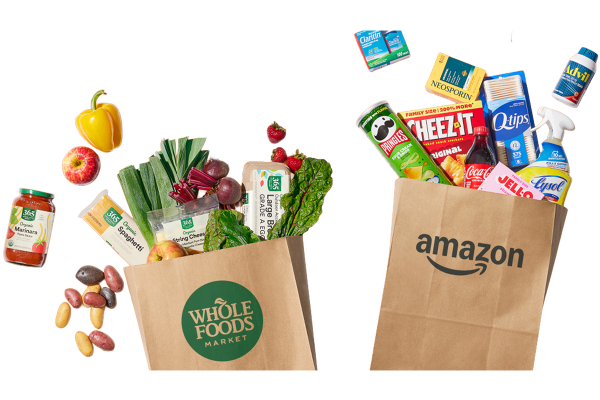 Whole Foods Market groceries and Amazon products in paper bags. Food includes pasta, produce, snacks, medicine, and cleaning supplies.