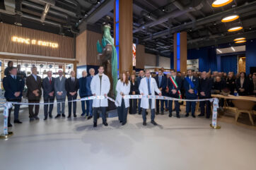 Barilla BITE Hub opening. Ribbon cutting ceremony for food innovation center. People in lab coats and suits.