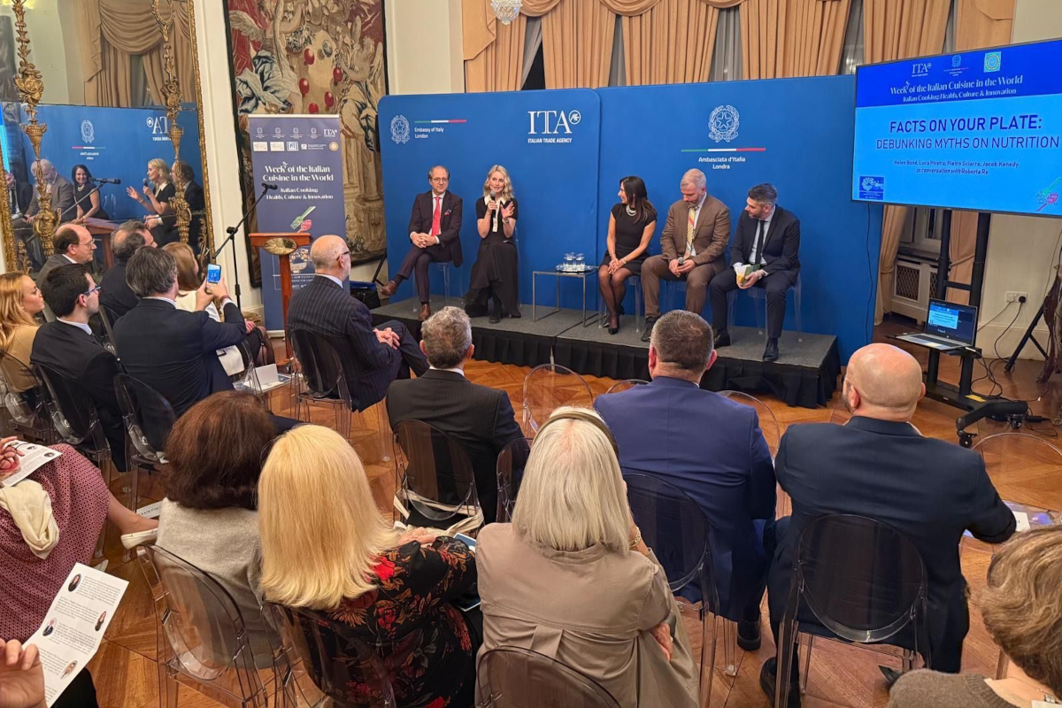 Week of Italian Cuisine event with speakers and audience. Italian food and culture promotion.