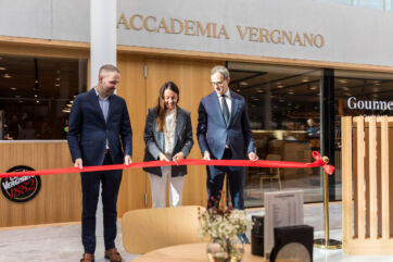 Caffè Vergnano, Accademia Vergnano grand opening. People cut red ribbon. Gourmet boutique. Coffee shop launch event.