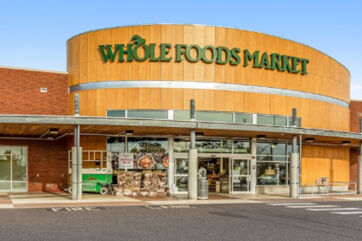 Whole Foods Market store exterior. Amazon store within a store partnership. Grocery shopping.