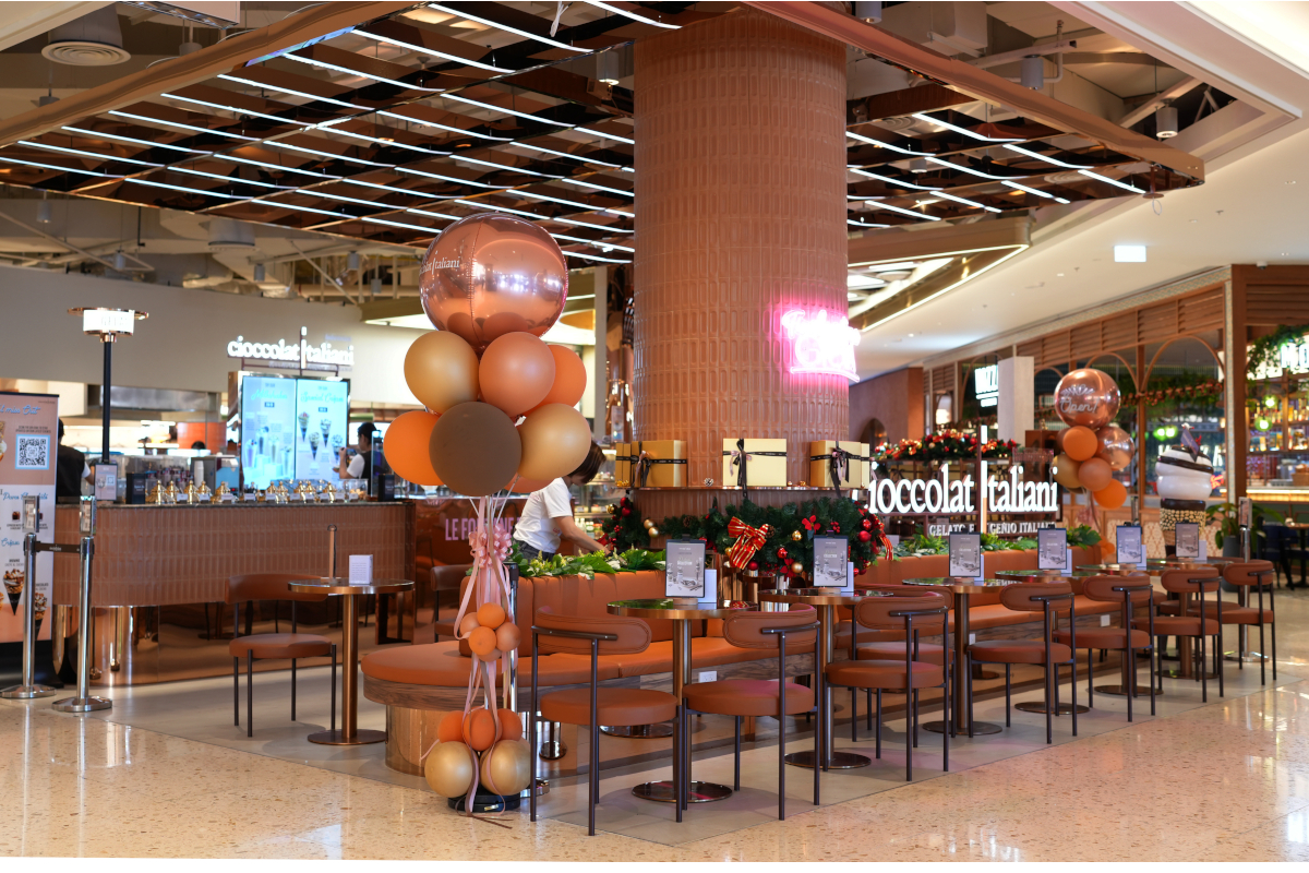 Cioccolatitaliani cafe in Bangkok, Thailand. Brown chairs and tables. Balloons decorate the gelato shop.