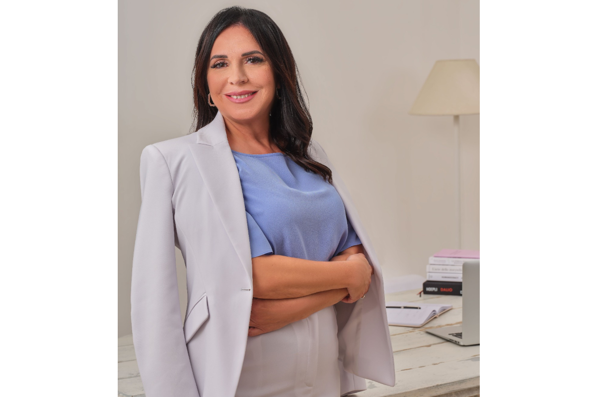 Lucia Forte, CEO of Oropan, poses in a blazer. Businesswoman portrait. Oropan executive.