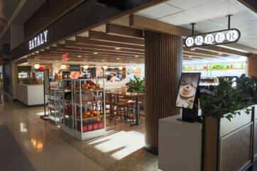 Eataly restaurant at JFK airport in New York. Italian food market with dining area. Order sign and display.