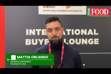 Mattia Orlando of Italgusto Inc. at Marca trade show, discussing Italian food in the Canadian market.