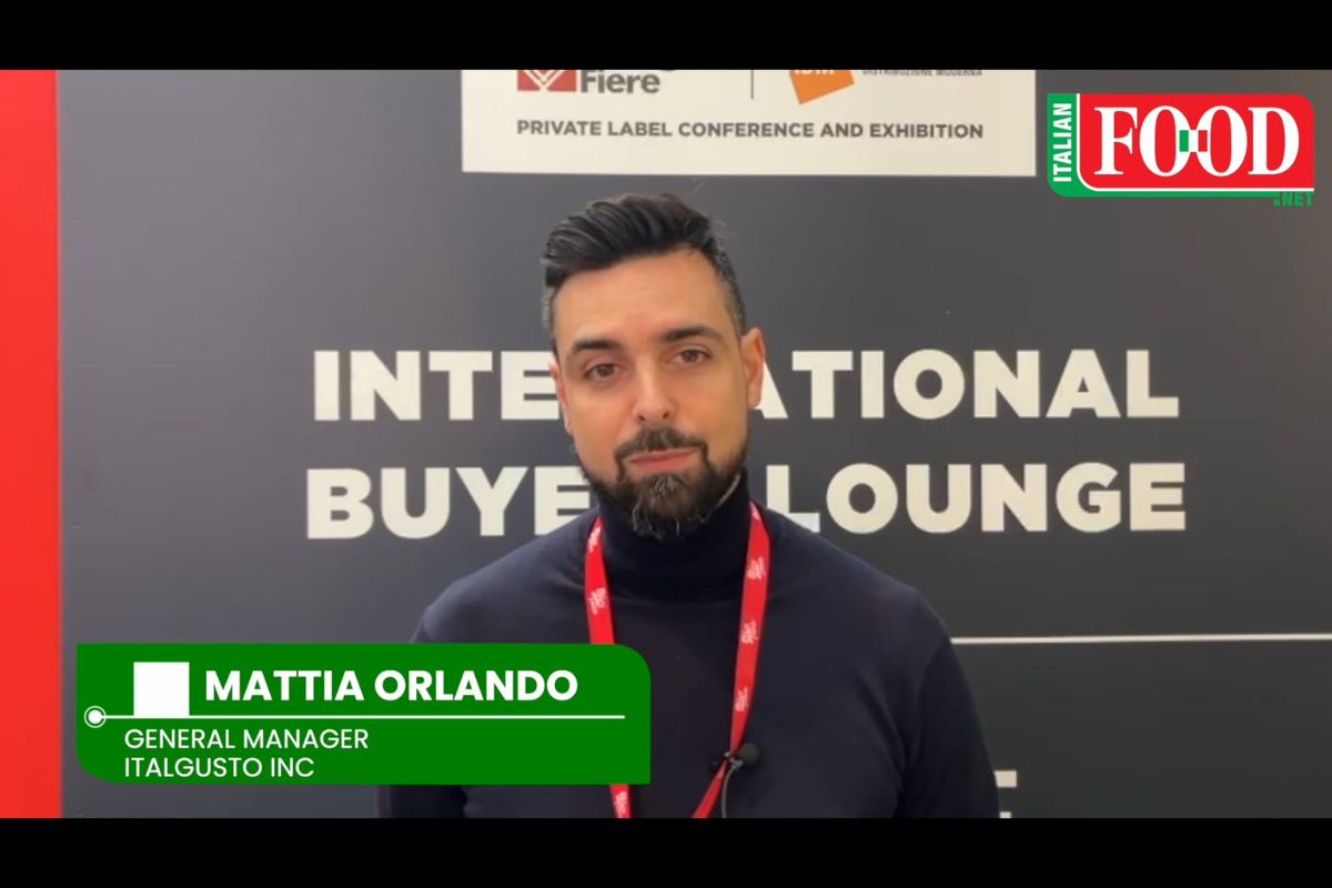 Mattia Orlando of Italgusto Inc. at Marca trade show, discussing Italian food in the Canadian market.