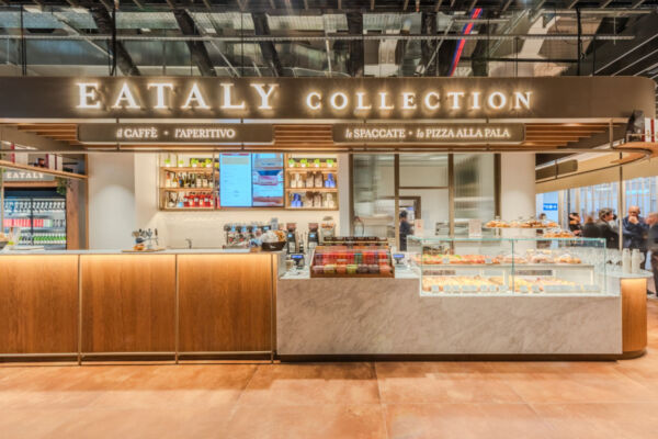 Eataly Collection food counter. Italian cafe with pastries, coffee, pizza, and aperitivo. Modern restaurant design. - Avolta
