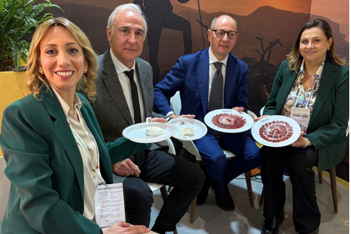 Group tasting Bufala Campana cheese and cured ham at Alimentaria Barcelona 2026. Food trade show.