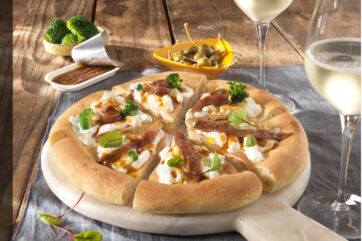 Rizzoli Emanuelli pizza with anchovies, broccoli, capers, and white wine. Pizza Expo 2026 debut.