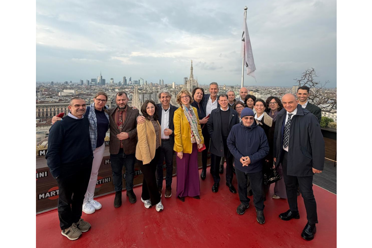 Coralis Annual General Meeting at Terrazza Martini. Group photo with Milan skyline backdrop.