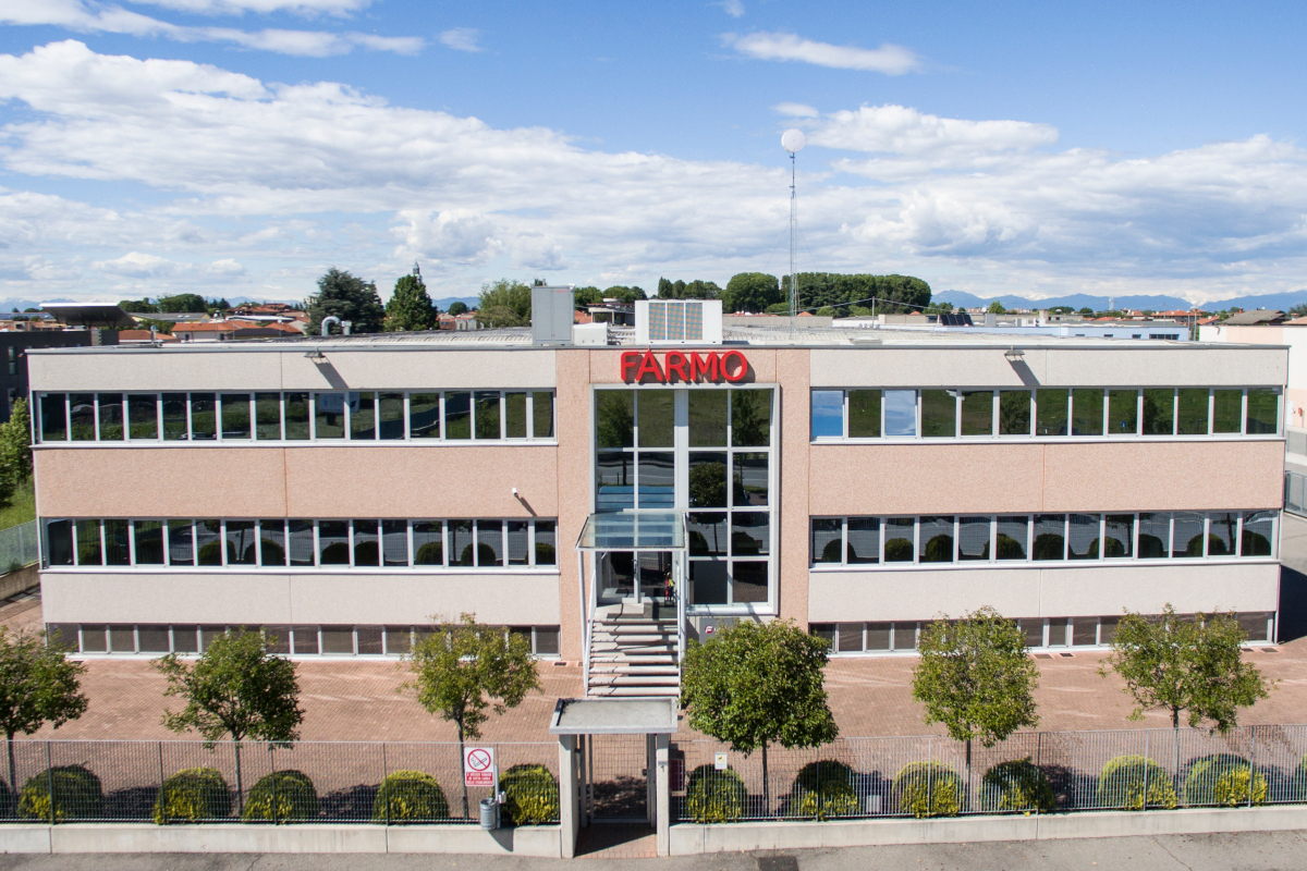 Farmo company building exterior. Modern architecture with large windows and the Farmo logo. Business and corporate.