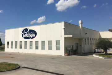 Polenghi headquarters building exterior. Polenghi Giancarlo logo on white facade. Food industry company.