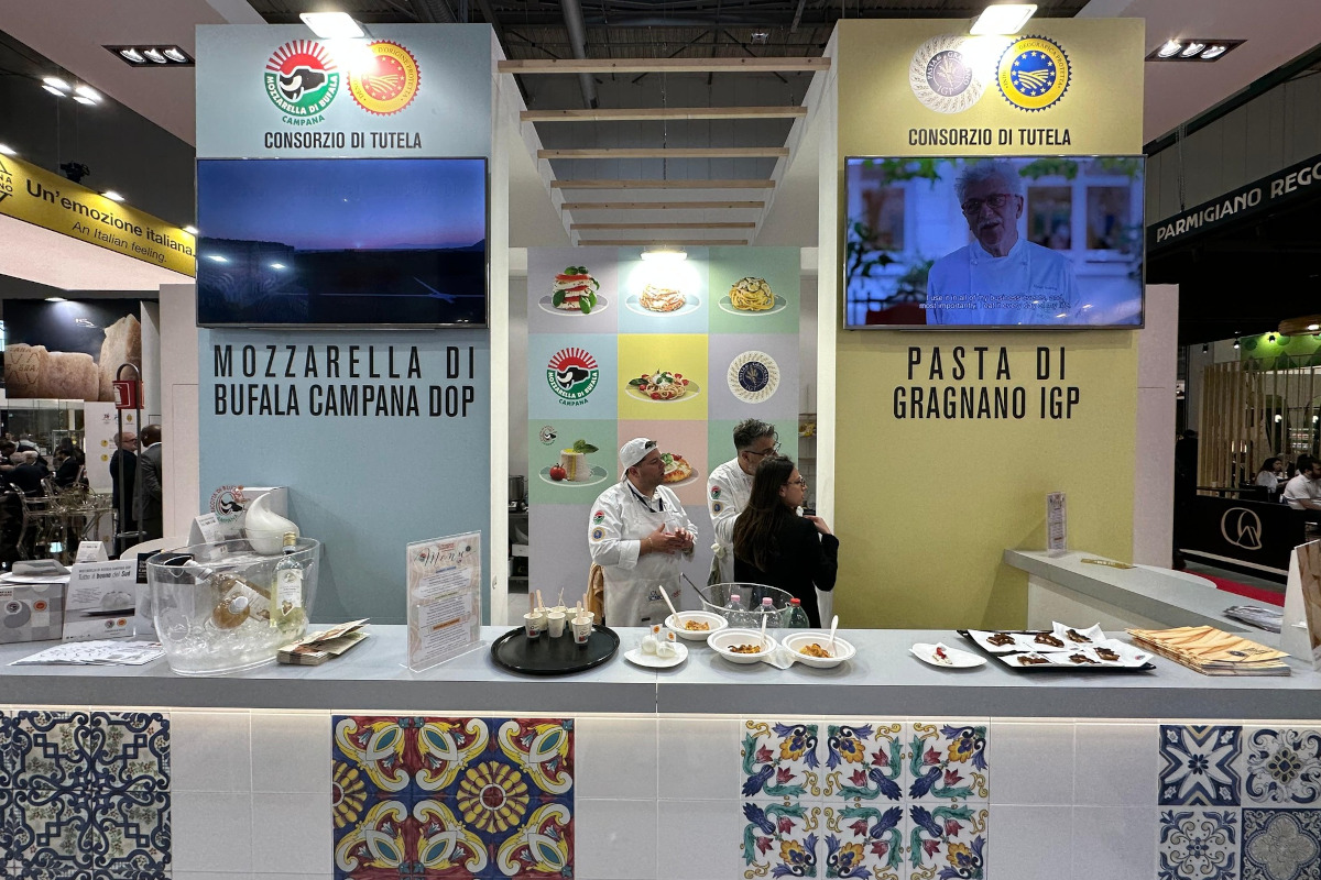 Tuttofood 2026: Mozzarella di Bufala Campana DOP and Pasta di Gragnano IGP stand featuring chefs and food samples.