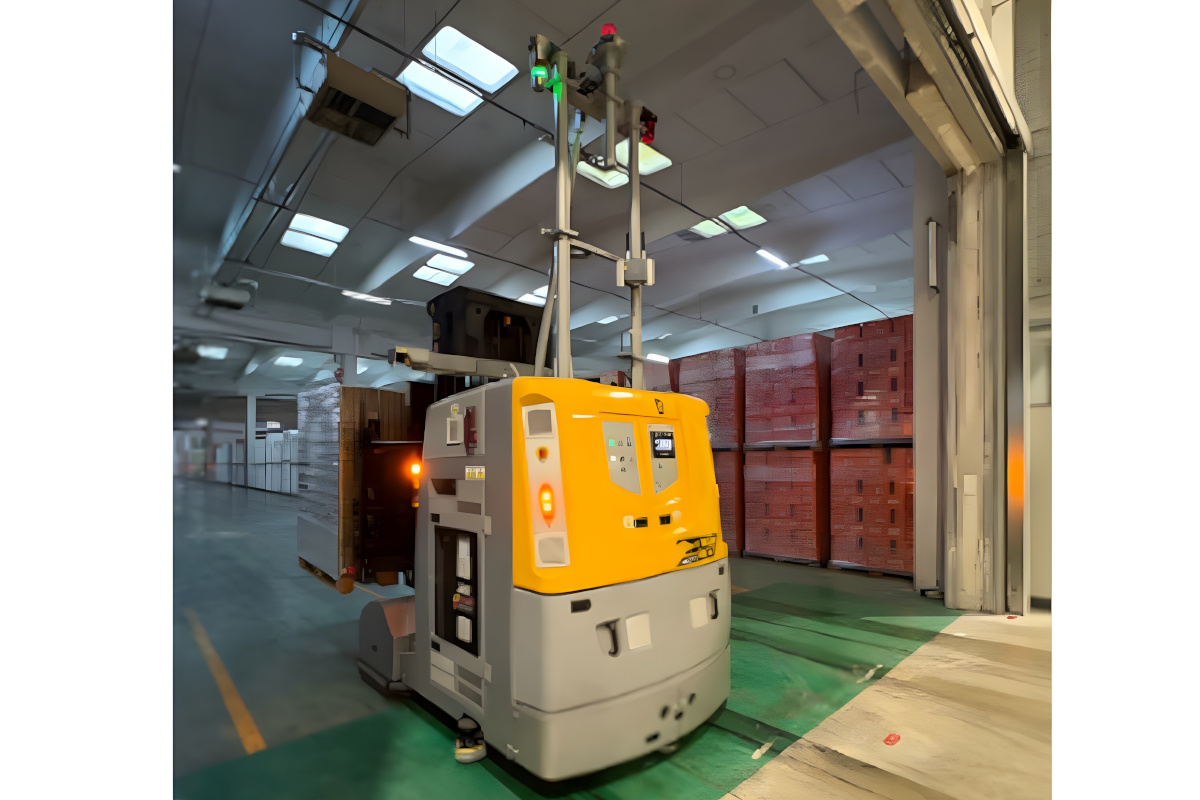 Automated LGV forklift moving palletized goods in a Refresco Italia warehouse facility with stacks of beverage crates.