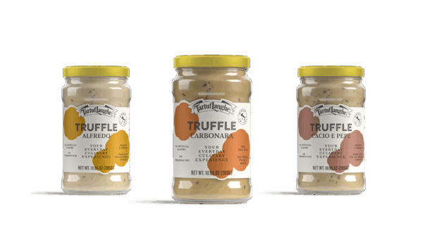 Three jars of Tartuflanghe truffle sauce: Alfredo, Carbonara, and Cacio e Pepe, finalists in the Italian Food Awards USA.