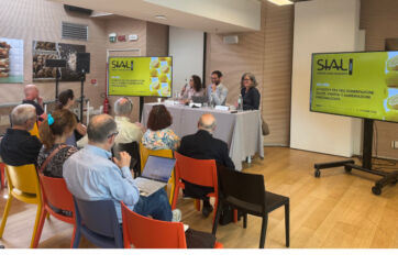 Speakers at a SIAL 2026 conference presentation in Paris discussing food business trends before an audience.