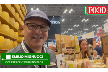 Emilio Mignucci of Di Bruno Bros at SFFS 2026, showcasing CPG brand products in front of a large cheese display.