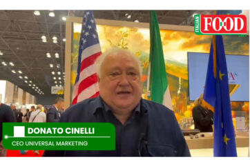 Donato Cinelli, CEO of Universal Marketing, at the Summer Fancy Food Show 2026 with US, Italian, and EU flags.