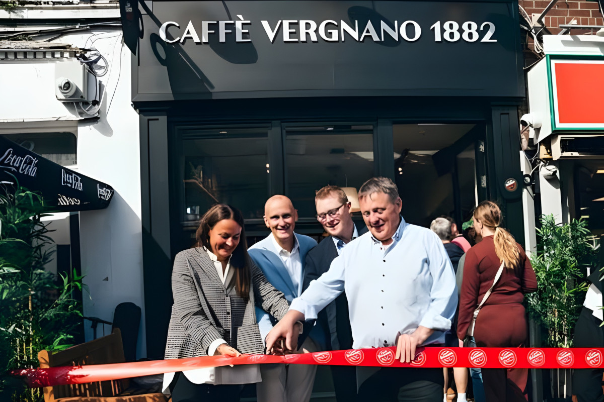 Caffè Vergnano 1882 coffee shop opening in Limerick, Ireland, with ribbon-cutting ceremony outside storefront.