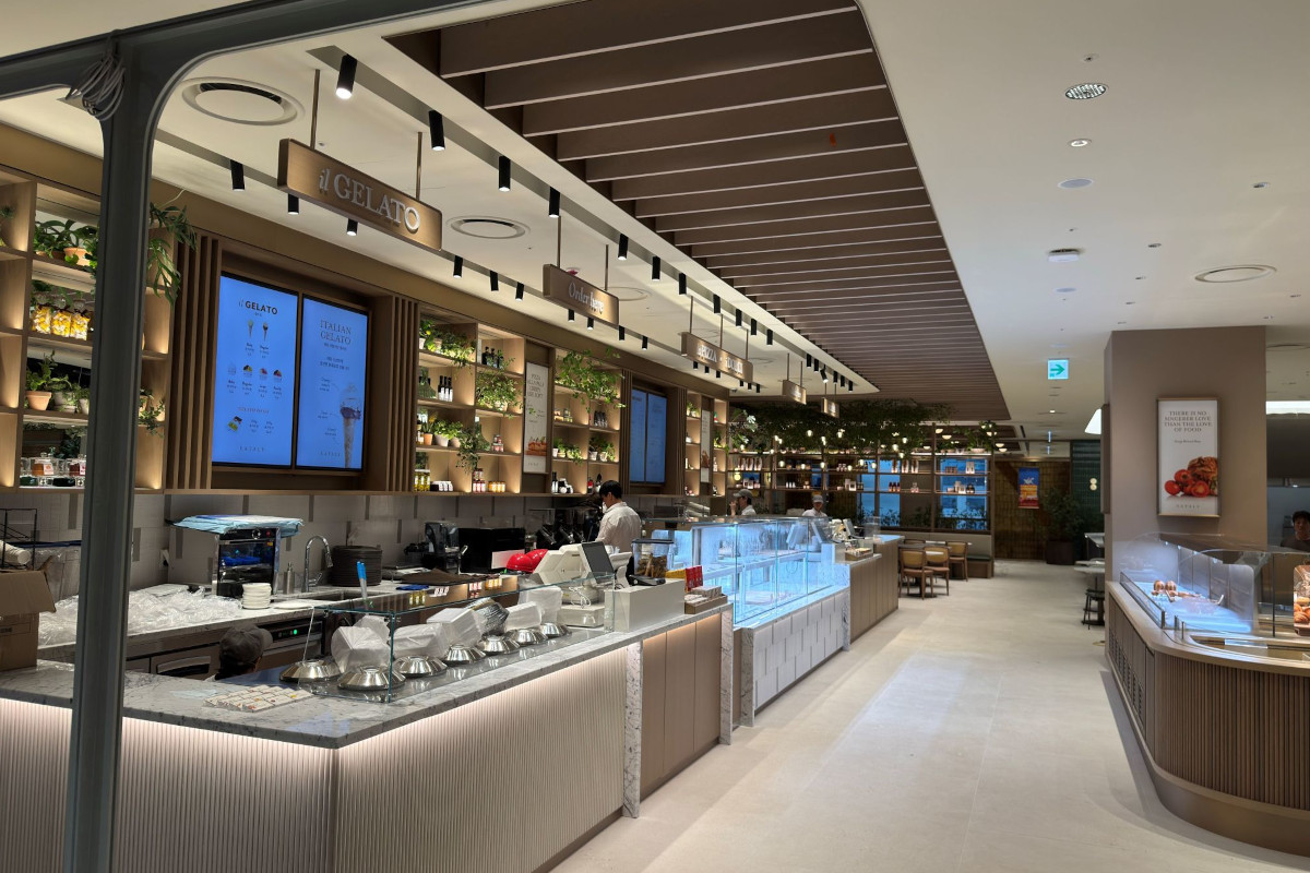 Modern interior of Eataly store in Seoul’s Gangnam district featuring an Il Gelato counter with marble and wood accents.