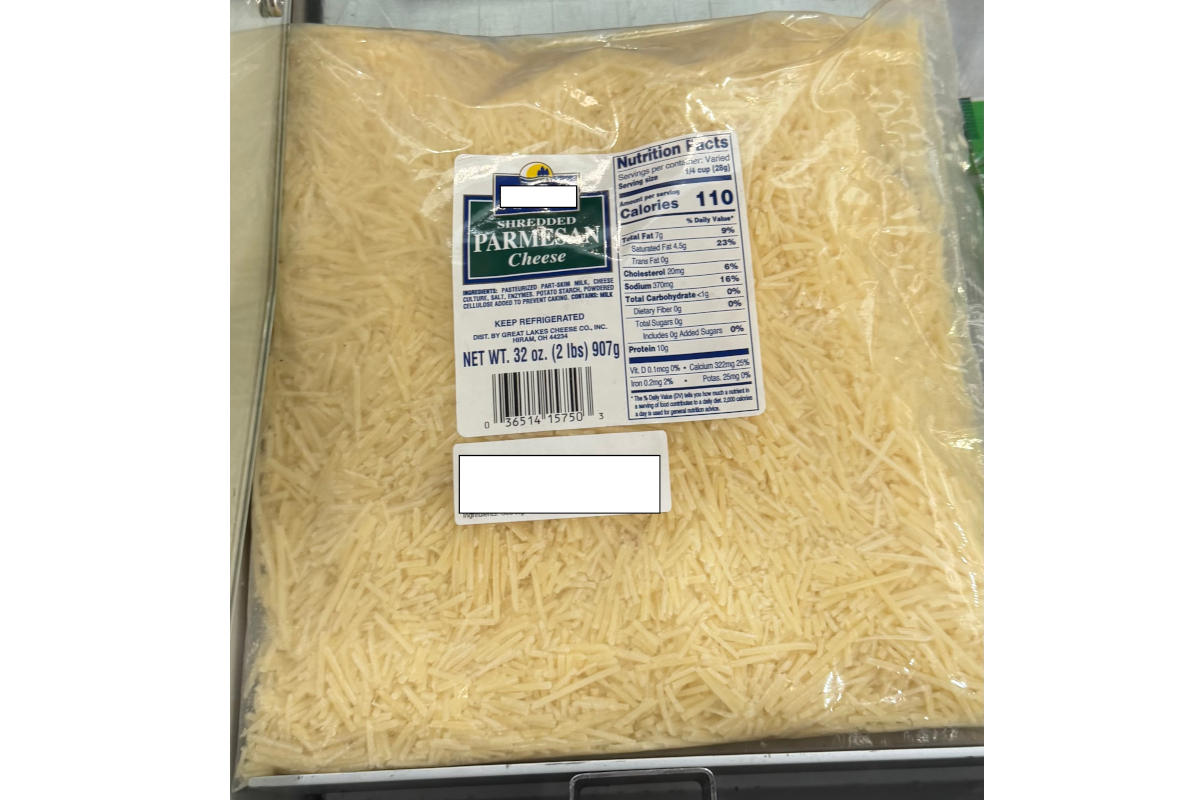 Plastic bag of grated cheese labeled Parmesan with a fake label, shown as counterfeit Parmigiano Reggiano at SIAL Paris.