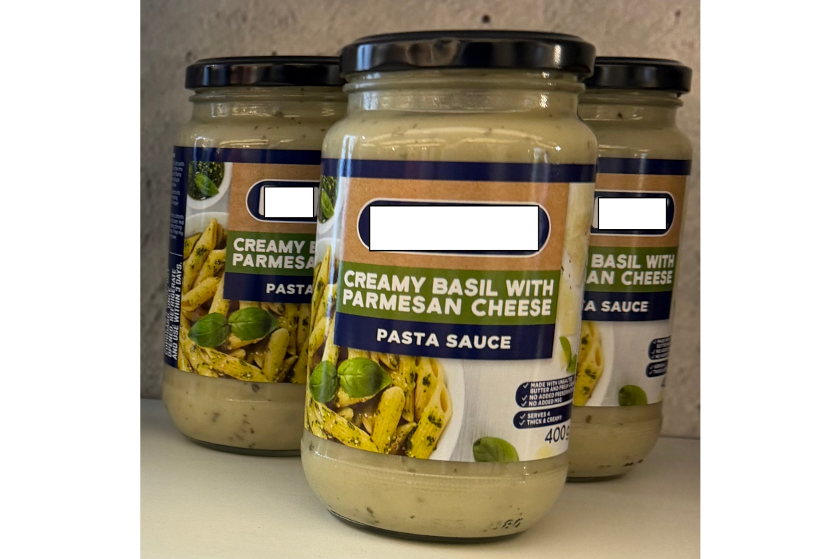 Jars of creamy basil with Parmesan cheese pasta sauce, illustrating fake Parmesan products at SIAL Paris.