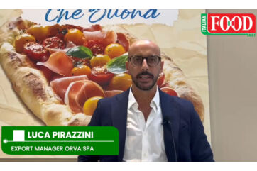 Luca Pirazzini, Export Manager Orva Spa, speaks at SIAL Paris 2026 with Italian pizza backdrop.