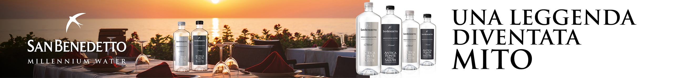 Acqua San Benedetto Mito: bottiglie su tavola imbandita al tramonto. Leaderboard Giugno 2026.