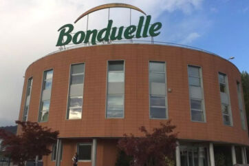 Sede Bonduelle Italia a San Paolo d'Argon, edificio curvo con insegna verde e divisione Out of home
