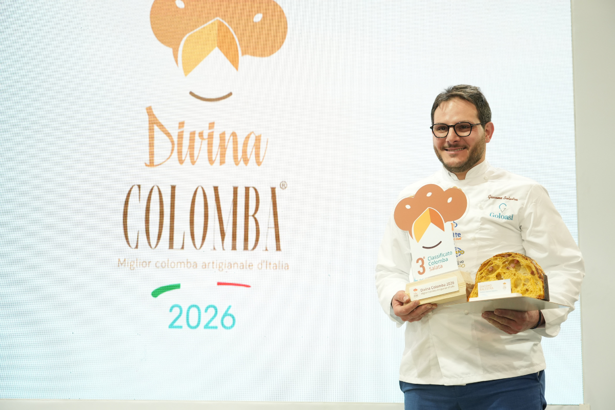 Podio Divina Colomba 2026: pasticcere con colomba artigianale premiata. Concorso miglior colomba d'Italia.