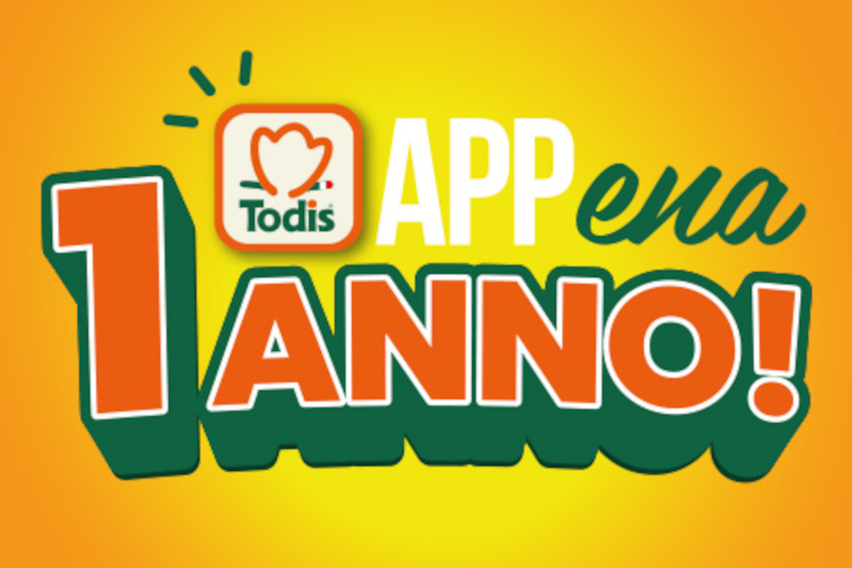 Grafica celebrativa 1 anno di Appena, app Todis, con logo Todis e sfondo giallo-arancione